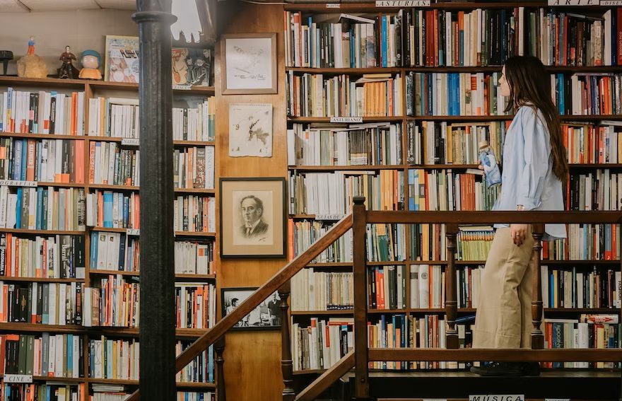 Woman looking at books on the shelves