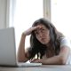 female freelancer using laptop at home
