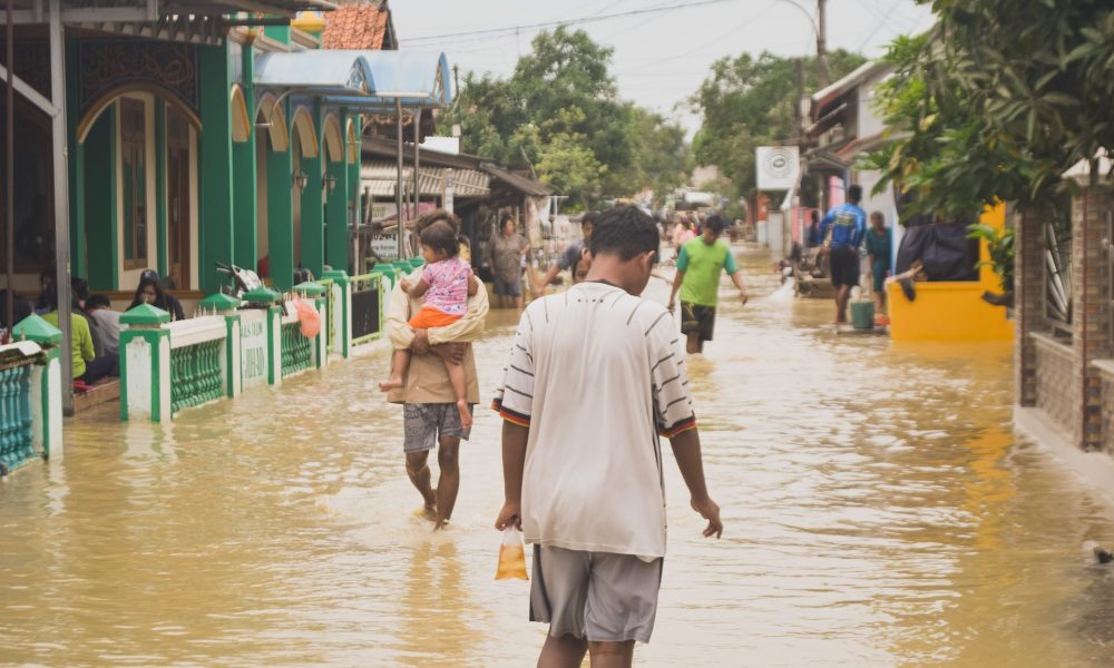 people walking flood