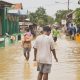 people walking flood