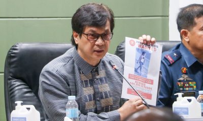 DILG Sec. shows a picture of one of the suspects