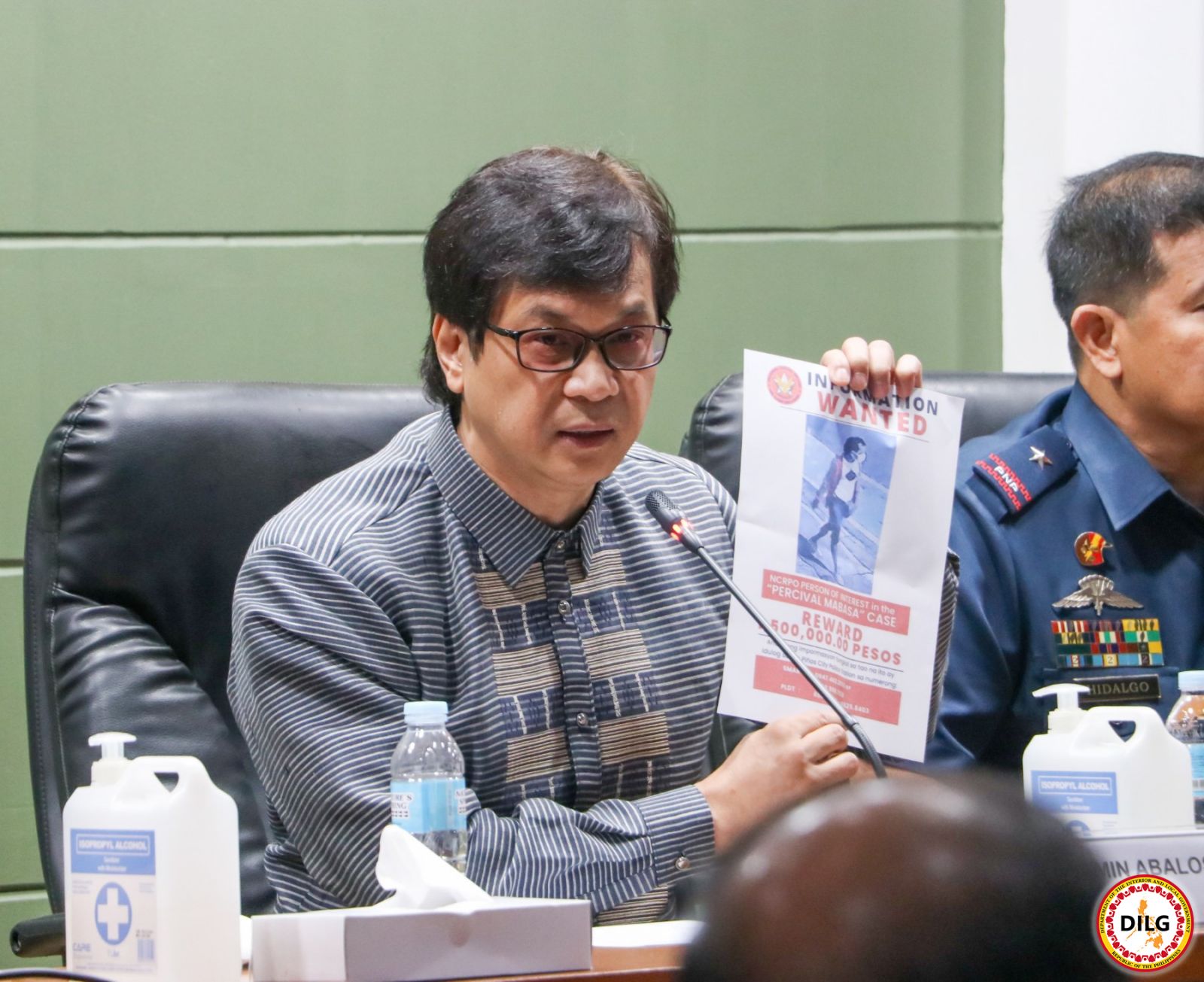 DILG Sec. shows a picture of one of the suspects