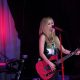 Avril performing holding pink guitar