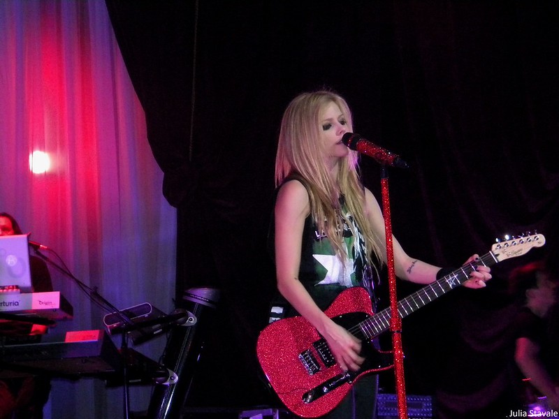 Avril performing holding pink guitar