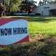 A now hiring sign outside a business