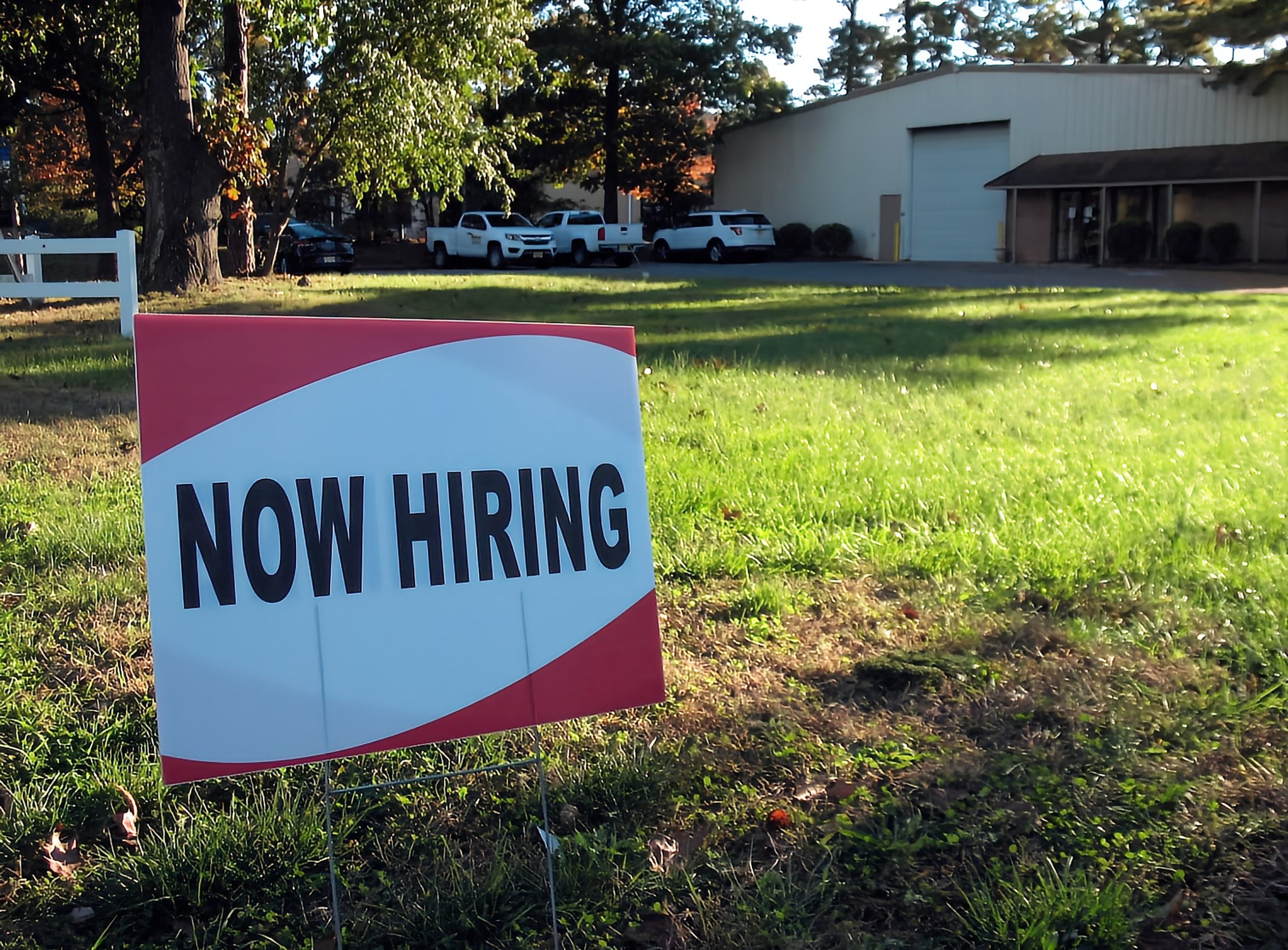 A now hiring sign outside a business