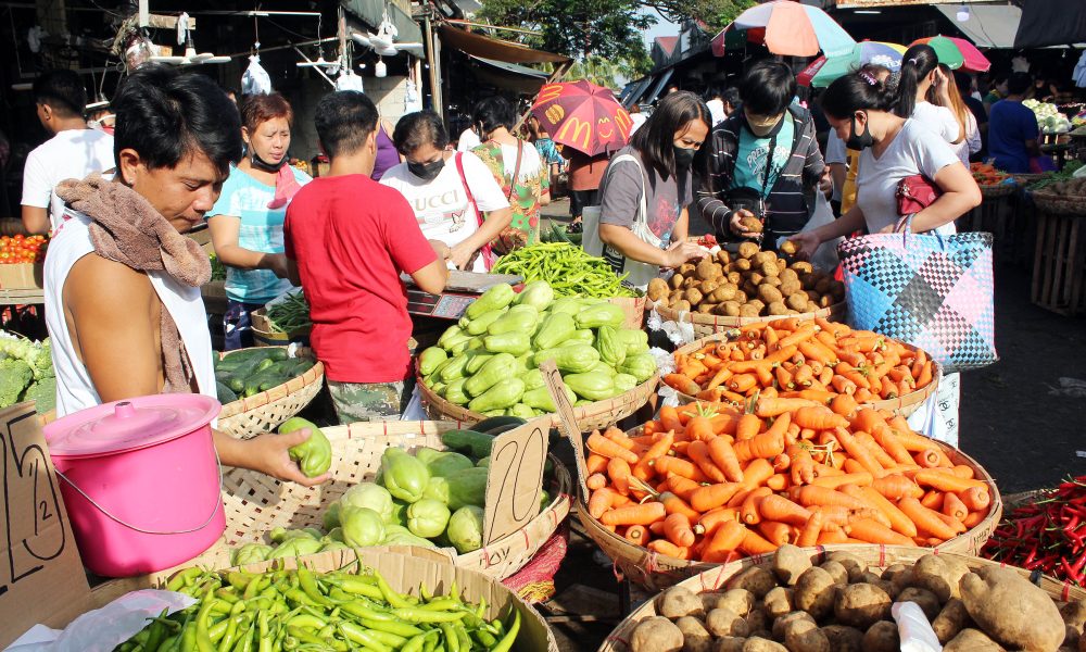 Customers buying vegetables