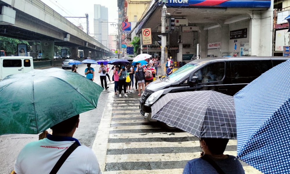 People using umbrellas