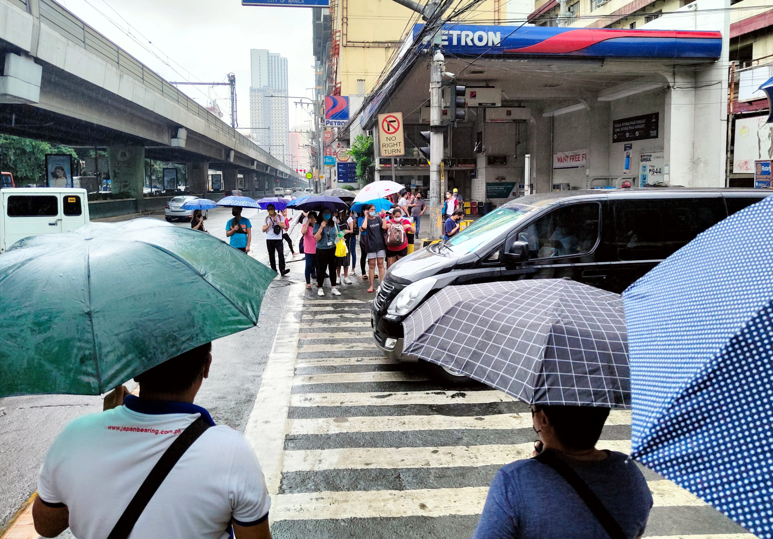 People using umbrellas