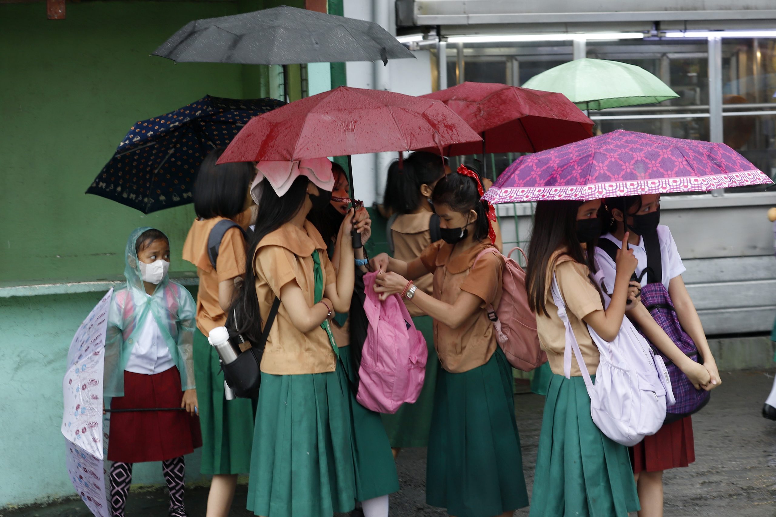 Students using umbrellas