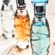 Three Assorted Clear Glass Perfume Spray Bottles