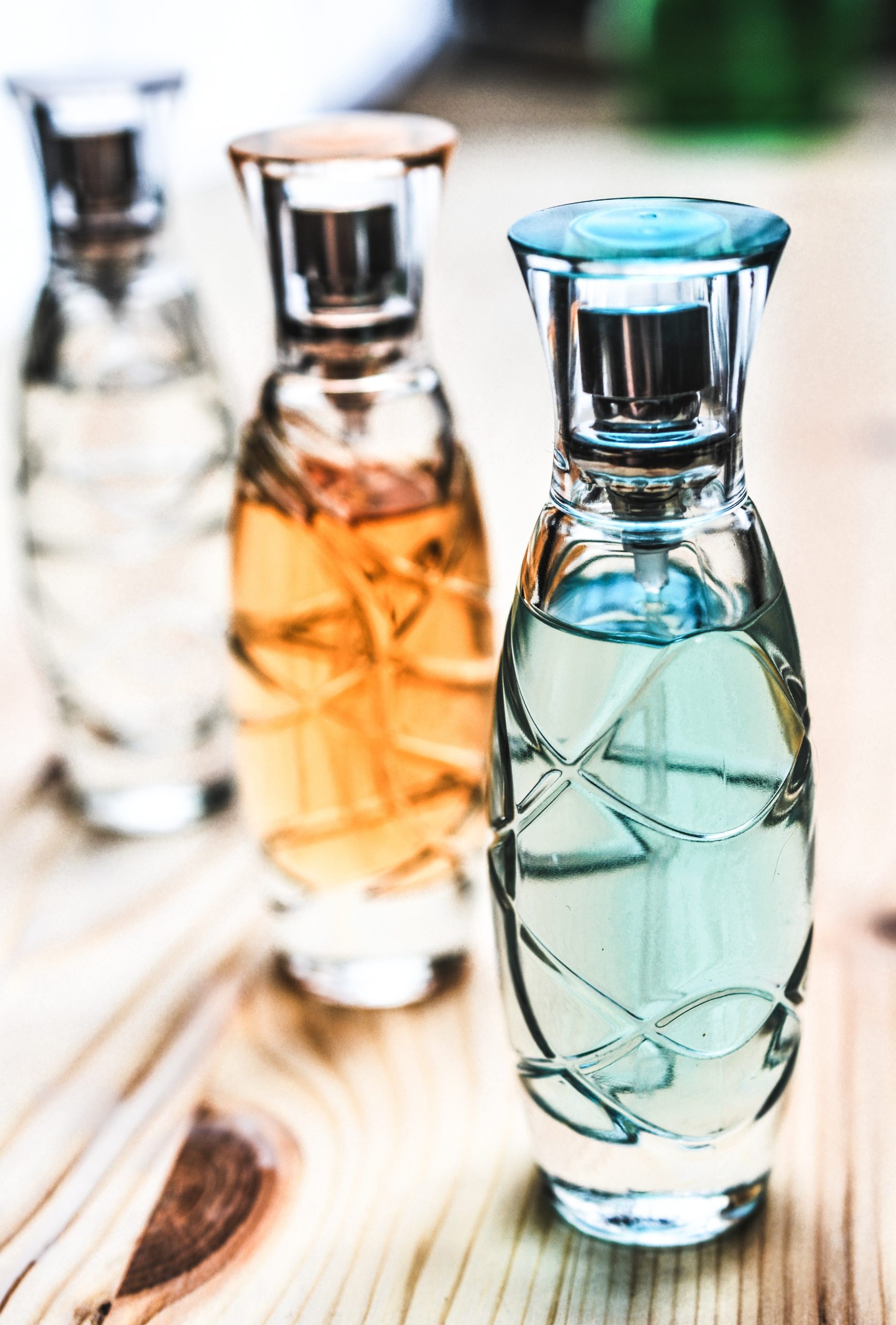 Three Assorted Clear Glass Perfume Spray Bottles