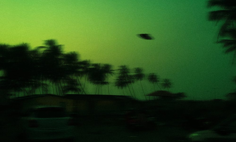 UFO on green sky