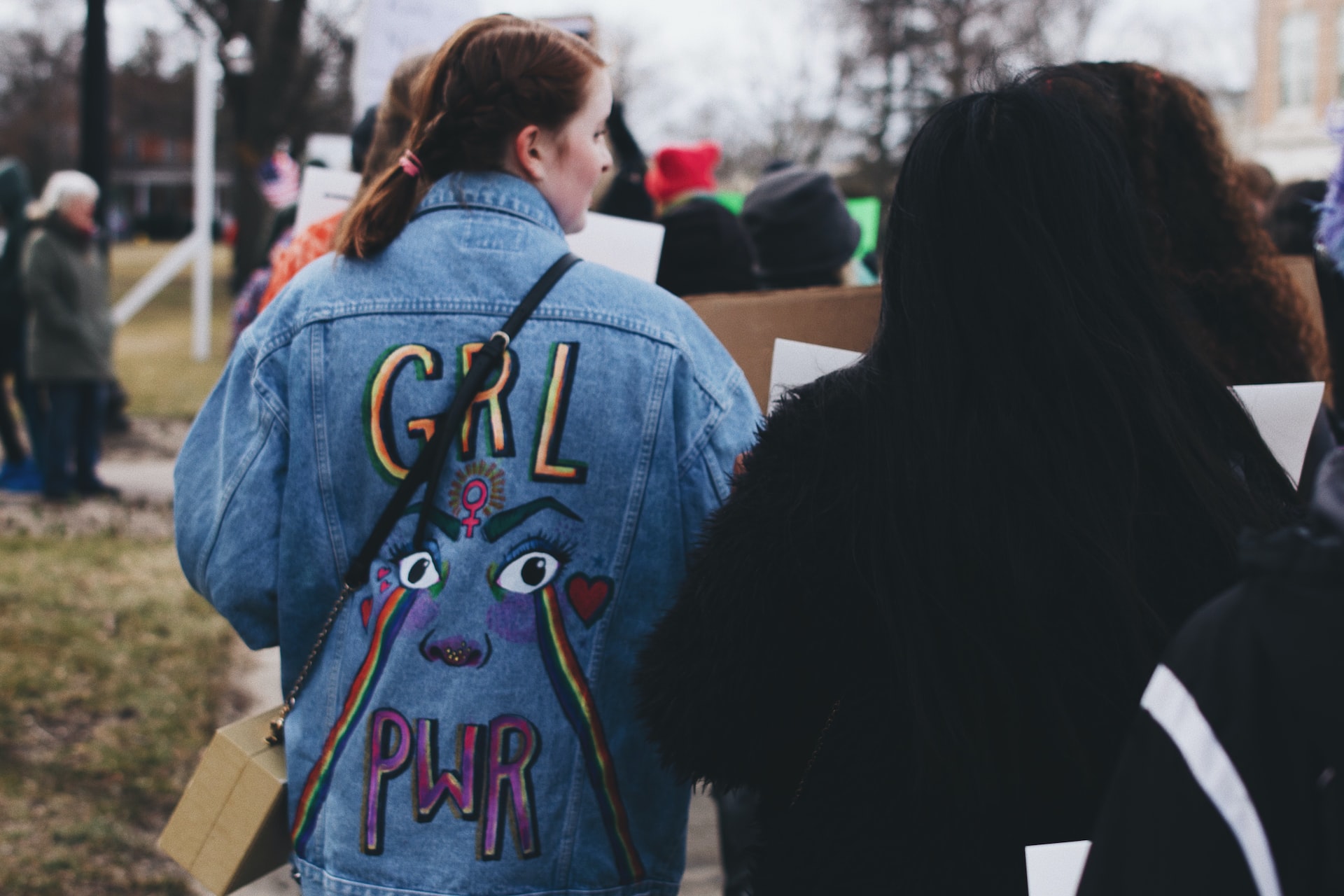 girl power on woman's denim jacket