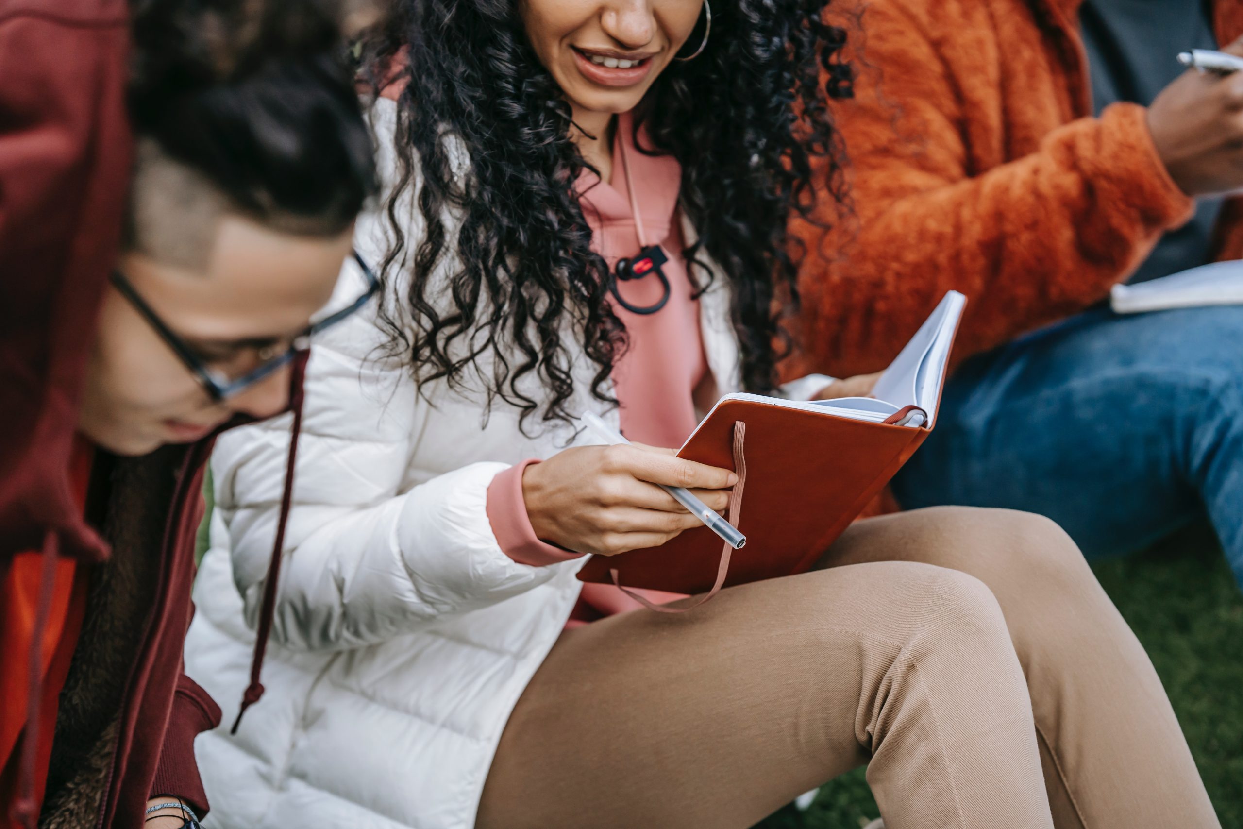 multiethnic students doing homework together