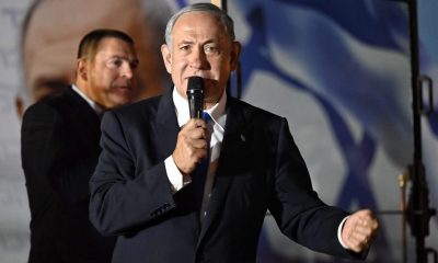 Benjamin Netanyahu holding mic speaking