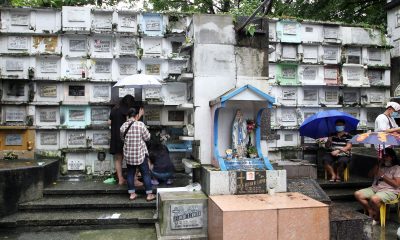 People visit the grave of their departed loved ones