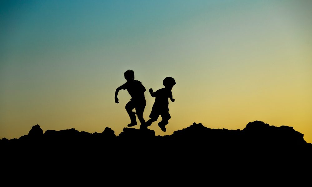 Silhouette Photo of Jumping Children