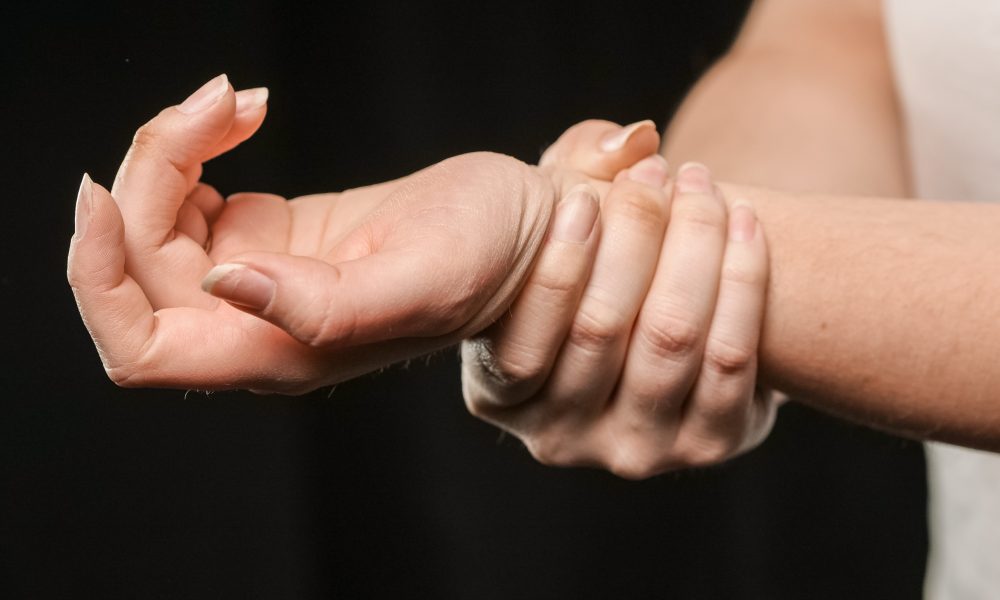 Woman Holding Her Wrist