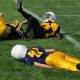 athlete lying on field