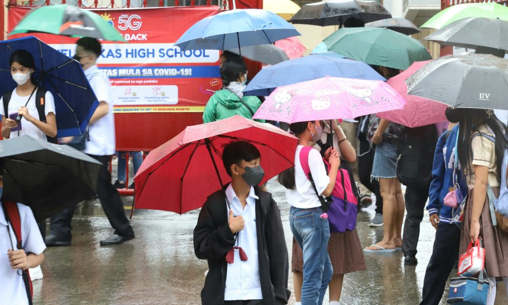 student using umbrella