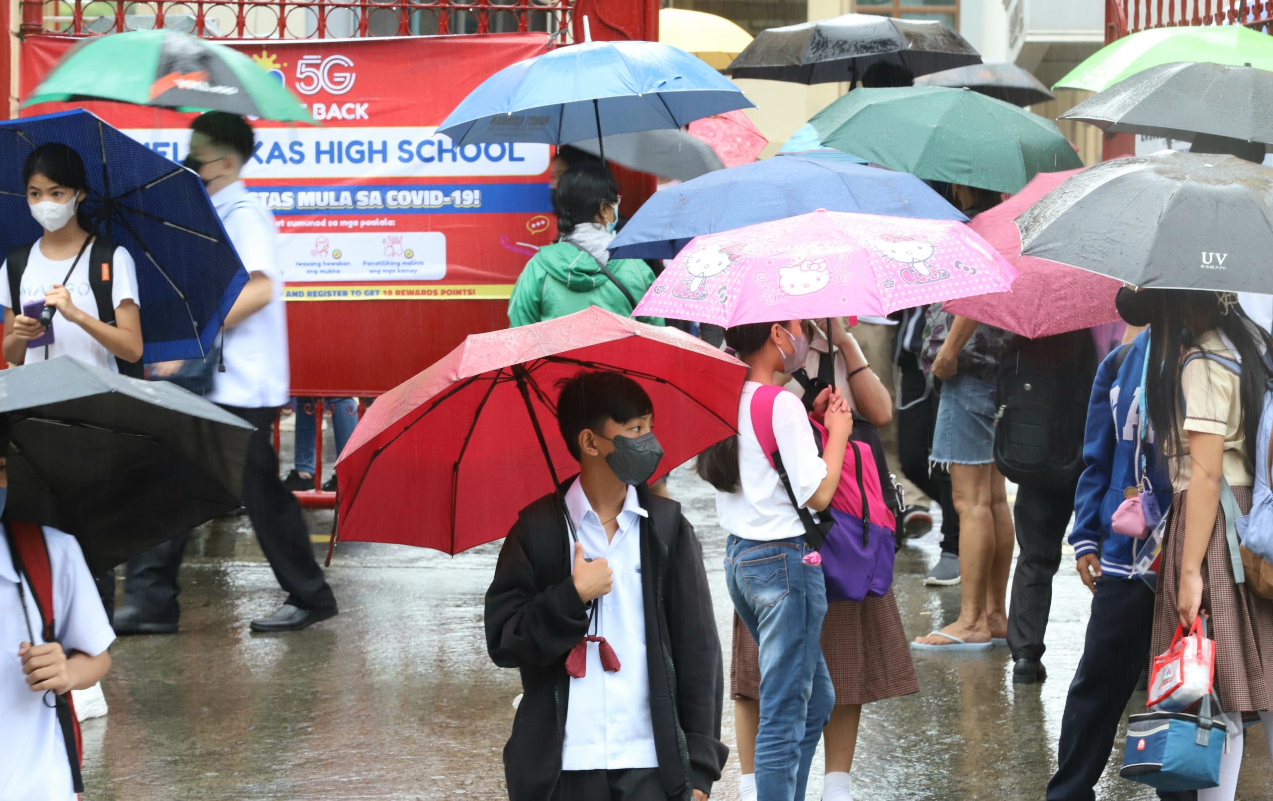 student using umbrella