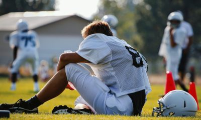 sitting football player