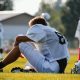 sitting football player