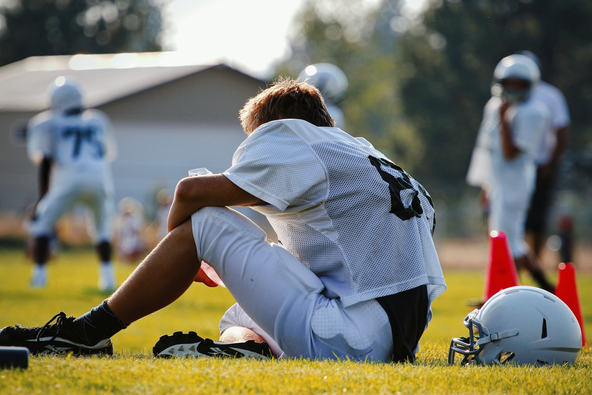 sitting football player