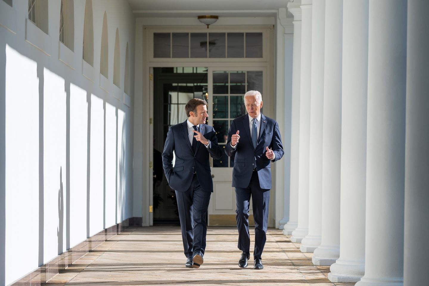 Macron and Biden walking while talking