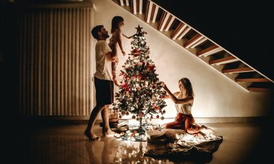 A family decorating their Christmas tree