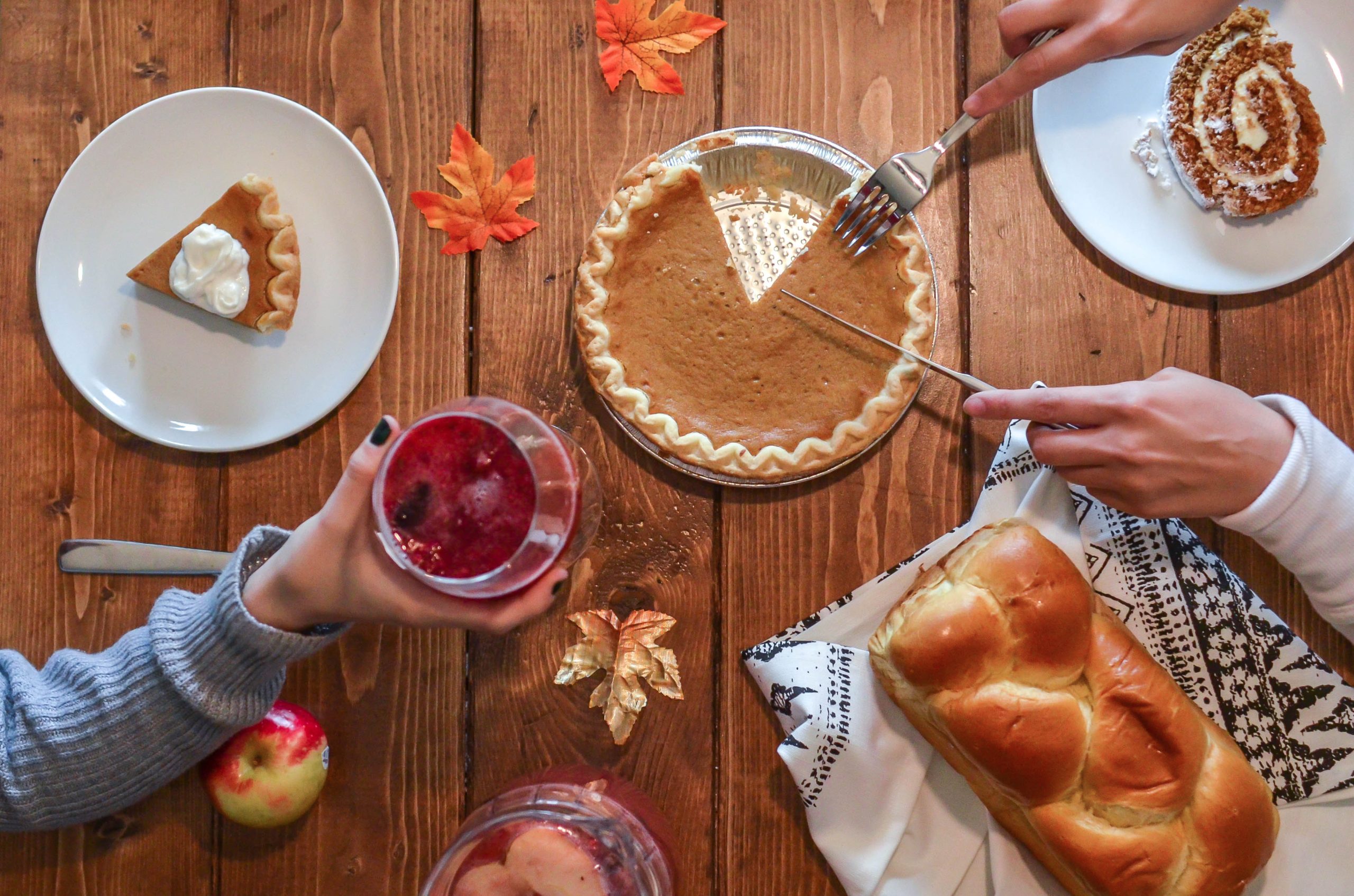 A person slicing a pie