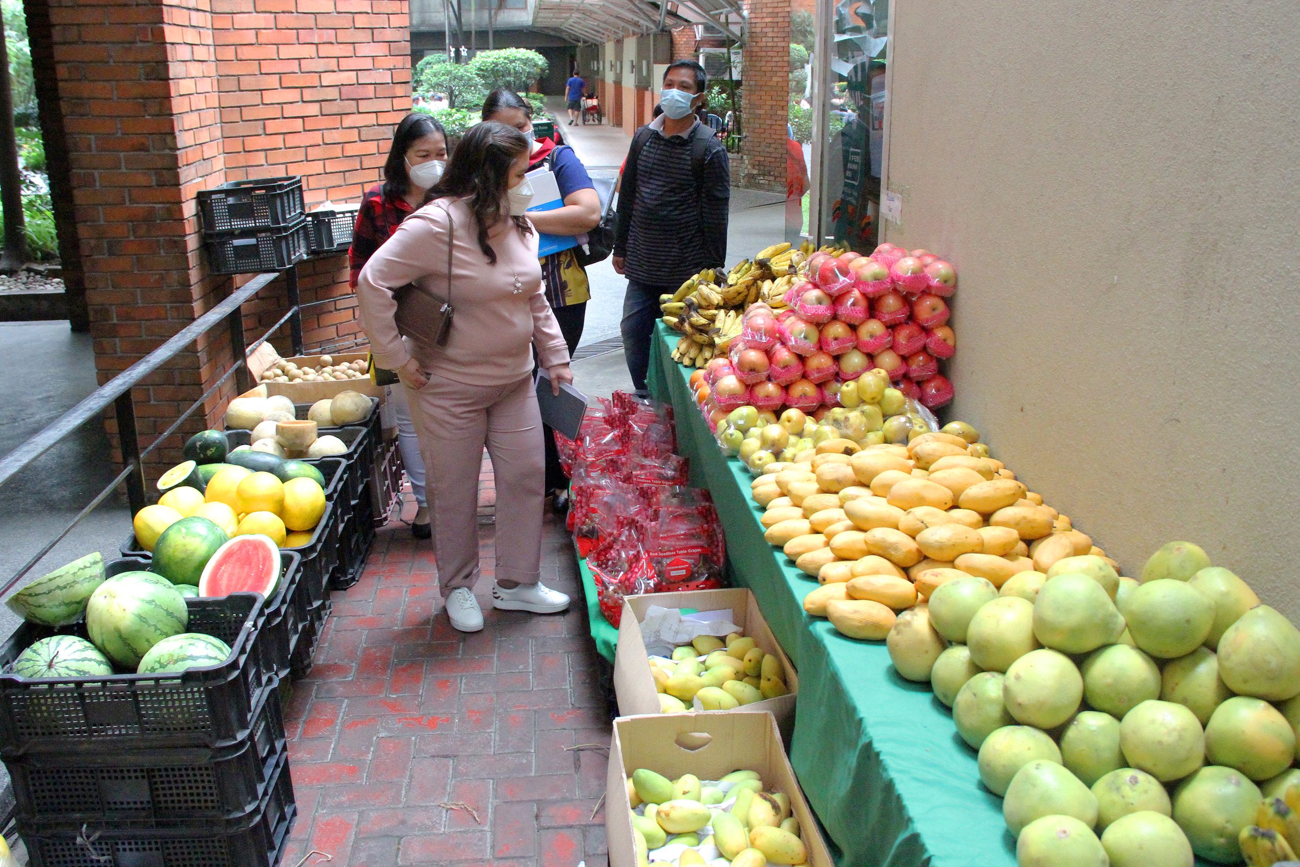 Customers looking at fresh fruits