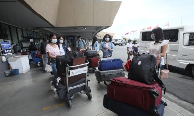 Passengers line up at the departure area of the Ninoy Aquino International Airport Terminal 1