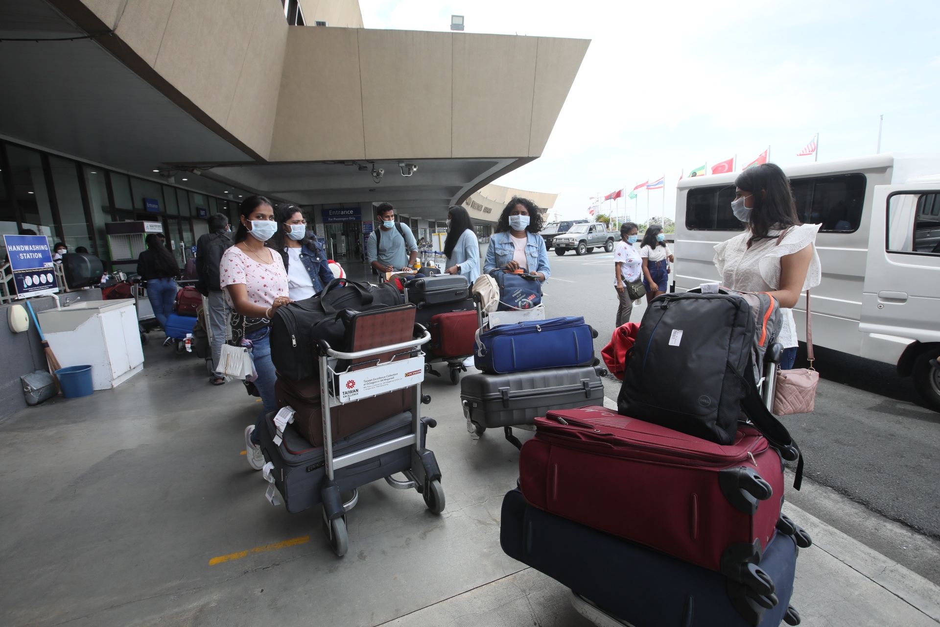 Passengers line up at the departure area of the Ninoy Aquino International Airport Terminal 1