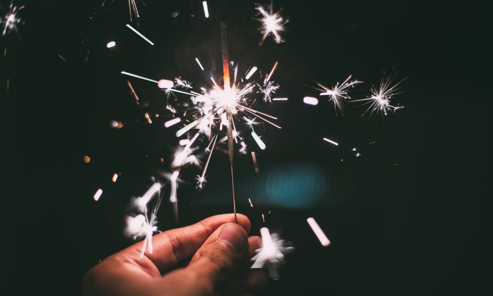 Person Holding Firecracker at Night