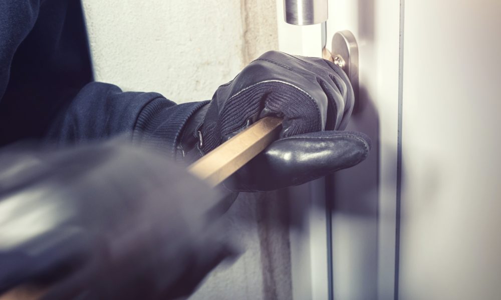 Person Opening a Door with a Bar