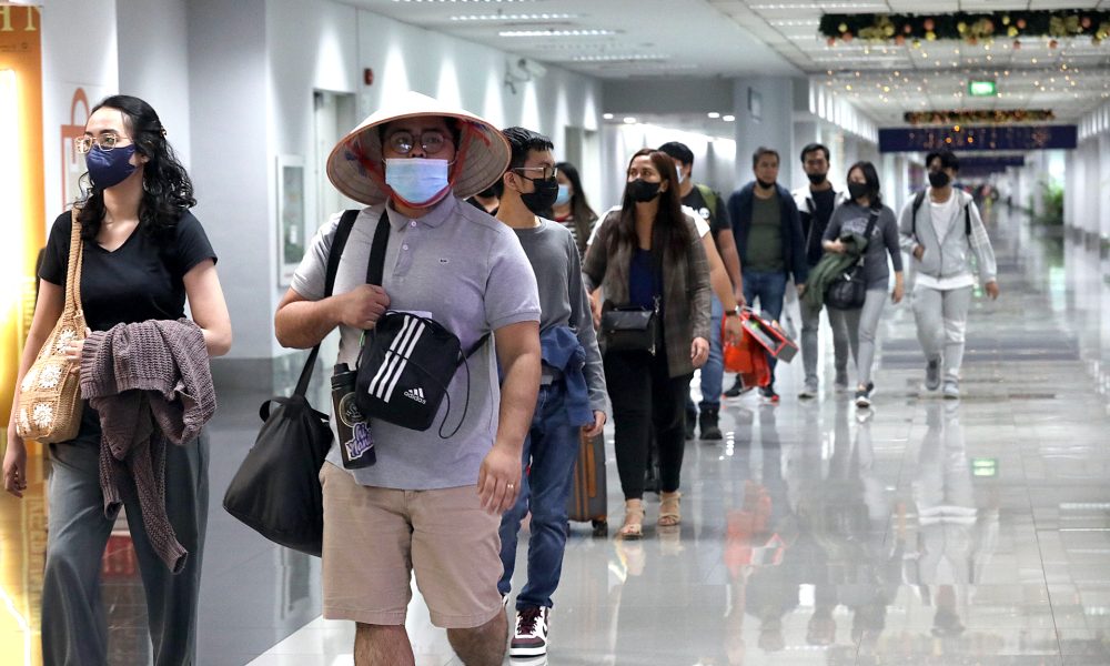 Travellers arriving at the Ninoy Aquino International Airport Terminal 3