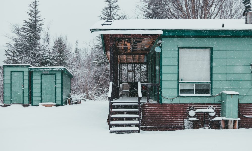 snow falling on house