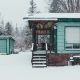 snow falling on house