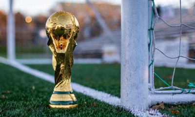 World Cup trophy on a soccer field