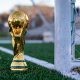 World Cup trophy on a soccer field