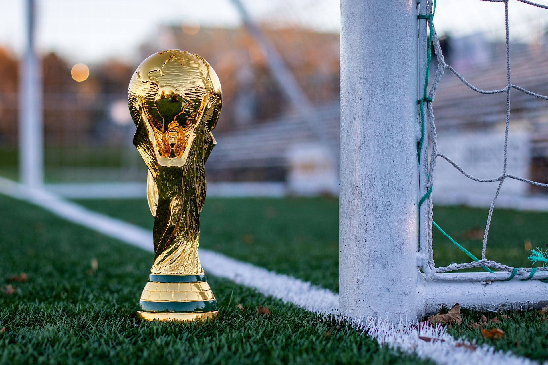 World Cup trophy on a soccer field