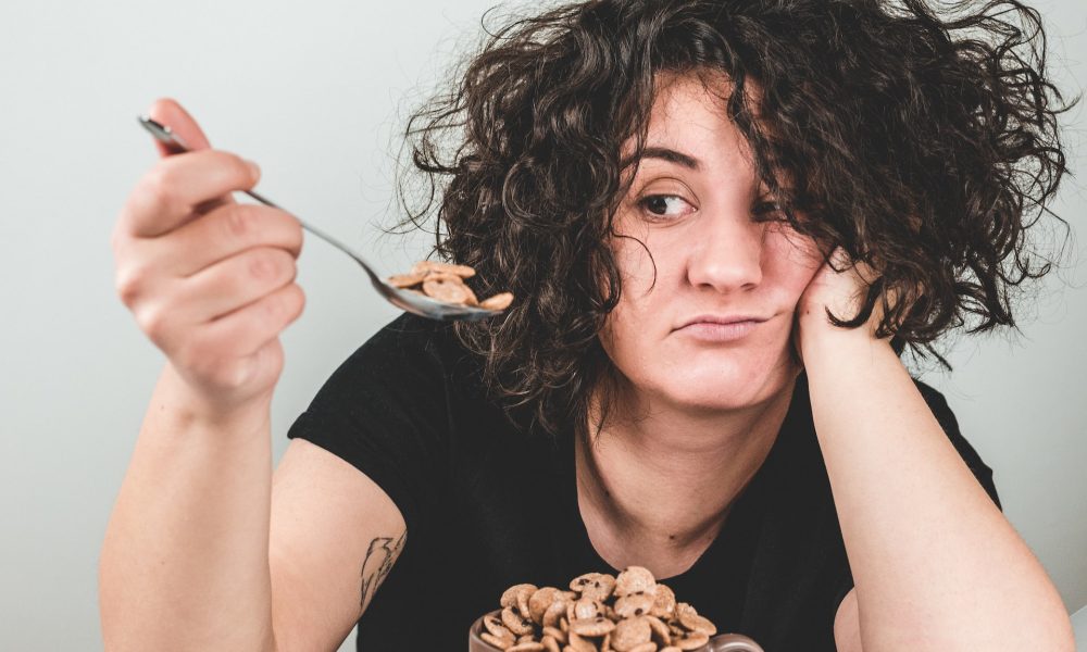 woman eating cereal