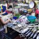 woman chooses from the variety of seafood in market