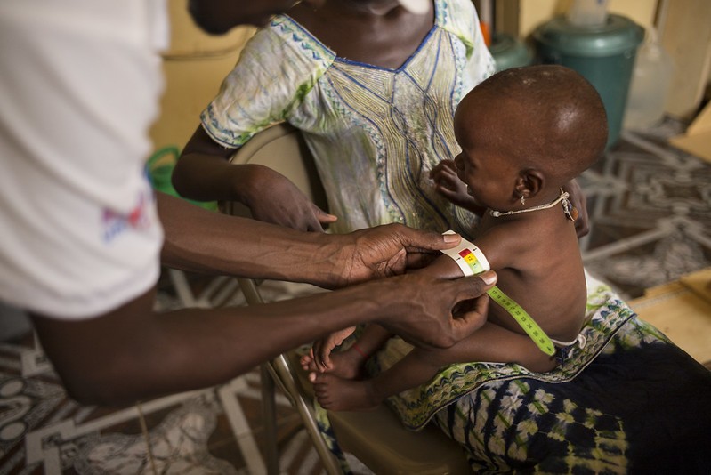 Measuring the mid-upper arm circumference of child