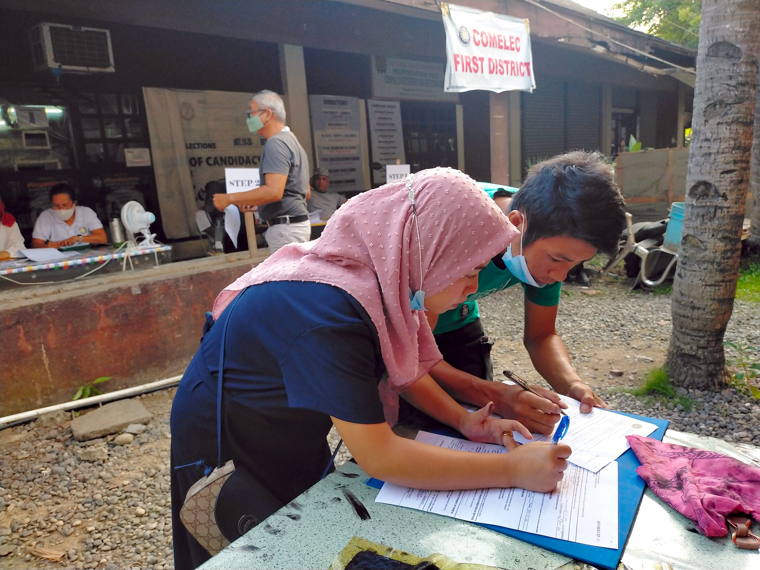 A couple filling out a registration form