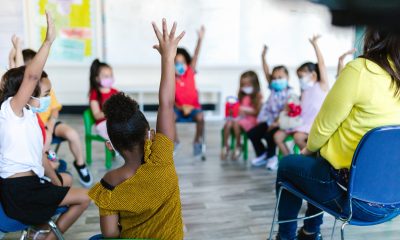 Kids Raising Their Hands in the Classroom