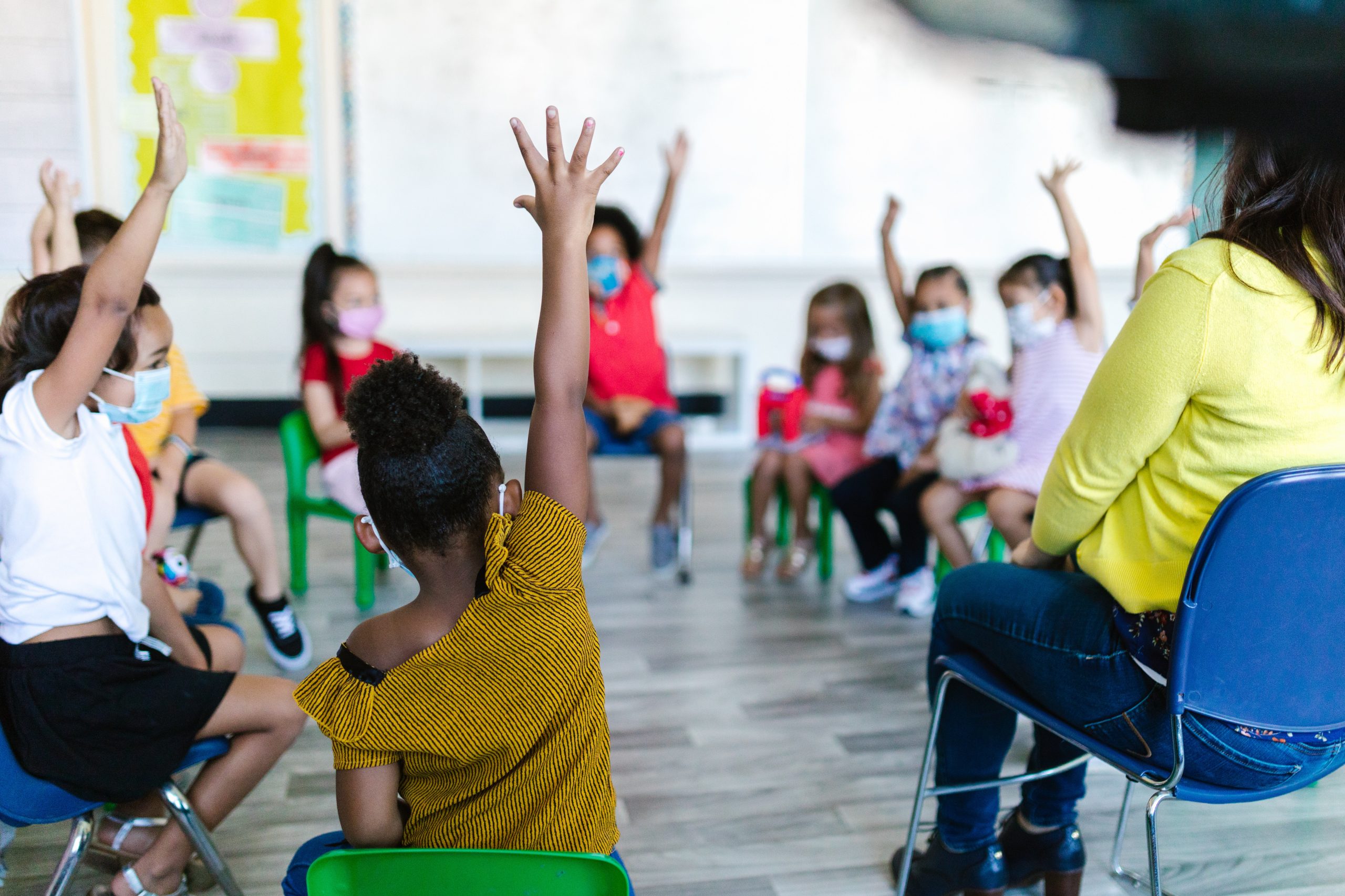 Kids Raising Their Hands in the Classroom