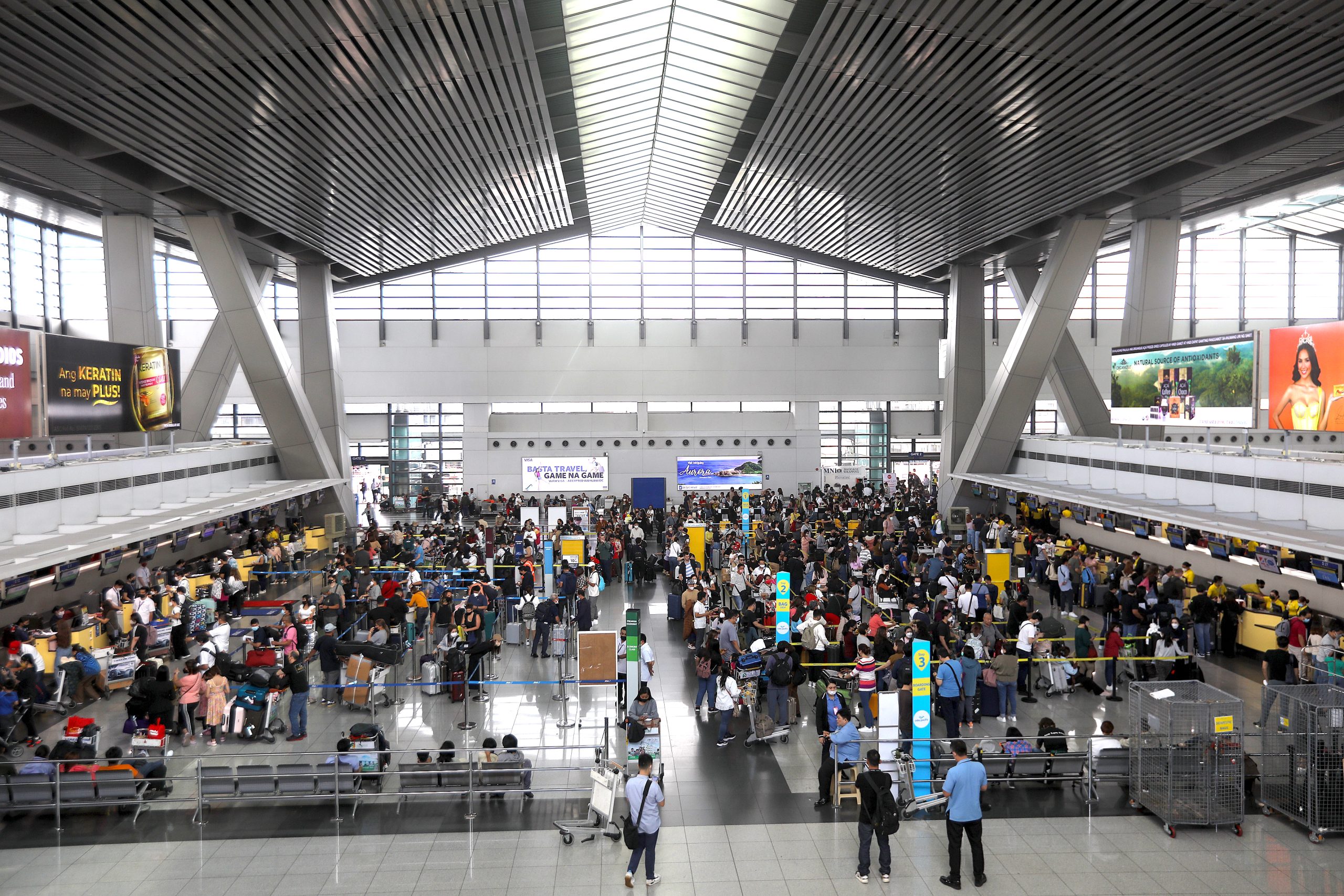 Passengers at NAIA Terminal 3 in Pasay City